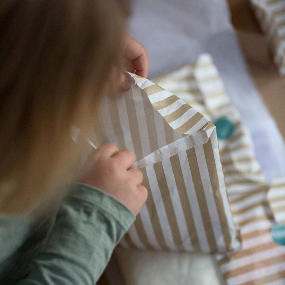 Child opening a My Mini Maker kit