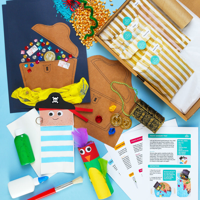 Craft kit with pirate-themed items on a blue background