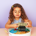 Child playing with a priate sensory play tray, the perfect play-based learning activities at home


