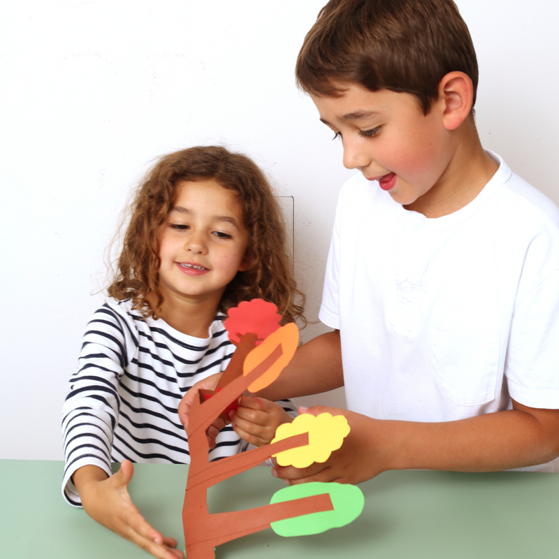 Kids playing with a forst craft idea from a craft box 