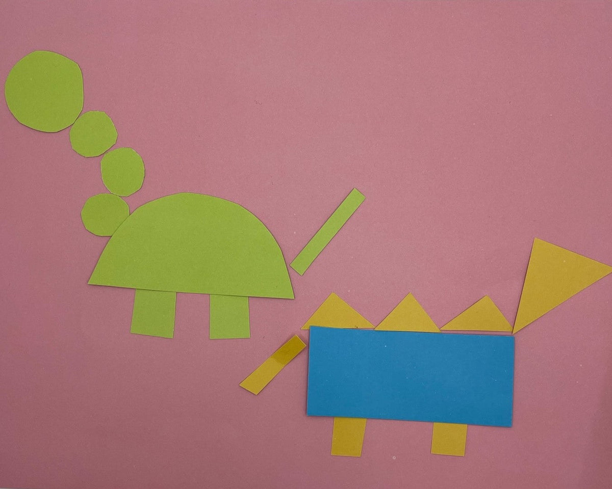 Dinosaur made from coloured paper shapes: half-circle body, triangle spikes and rectangle legs