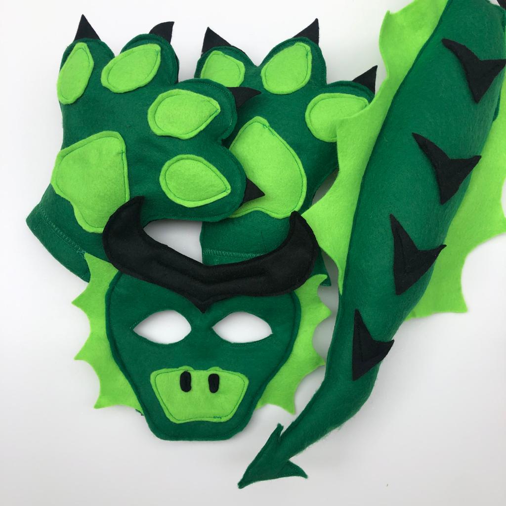 Child wearing a homemade felt dragon mask and tail
