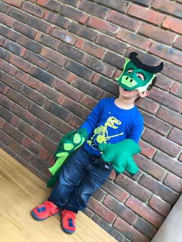 Felt dragon mask pieces pinned and sewn, with horns, snout and side frills