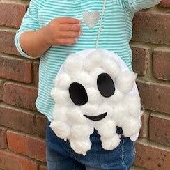 Halloween ghost craft made from white paper covered in cotton wool with black paper eyes
