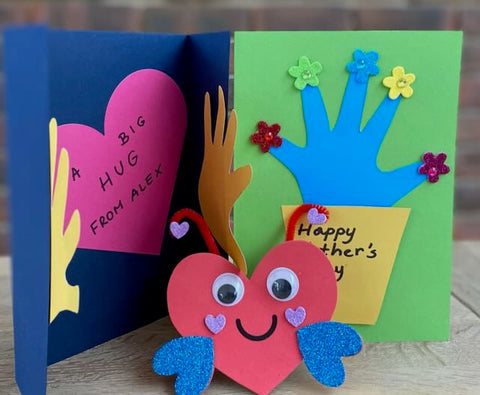 Handprint flowerpot card with a flower sticker on each fingertip