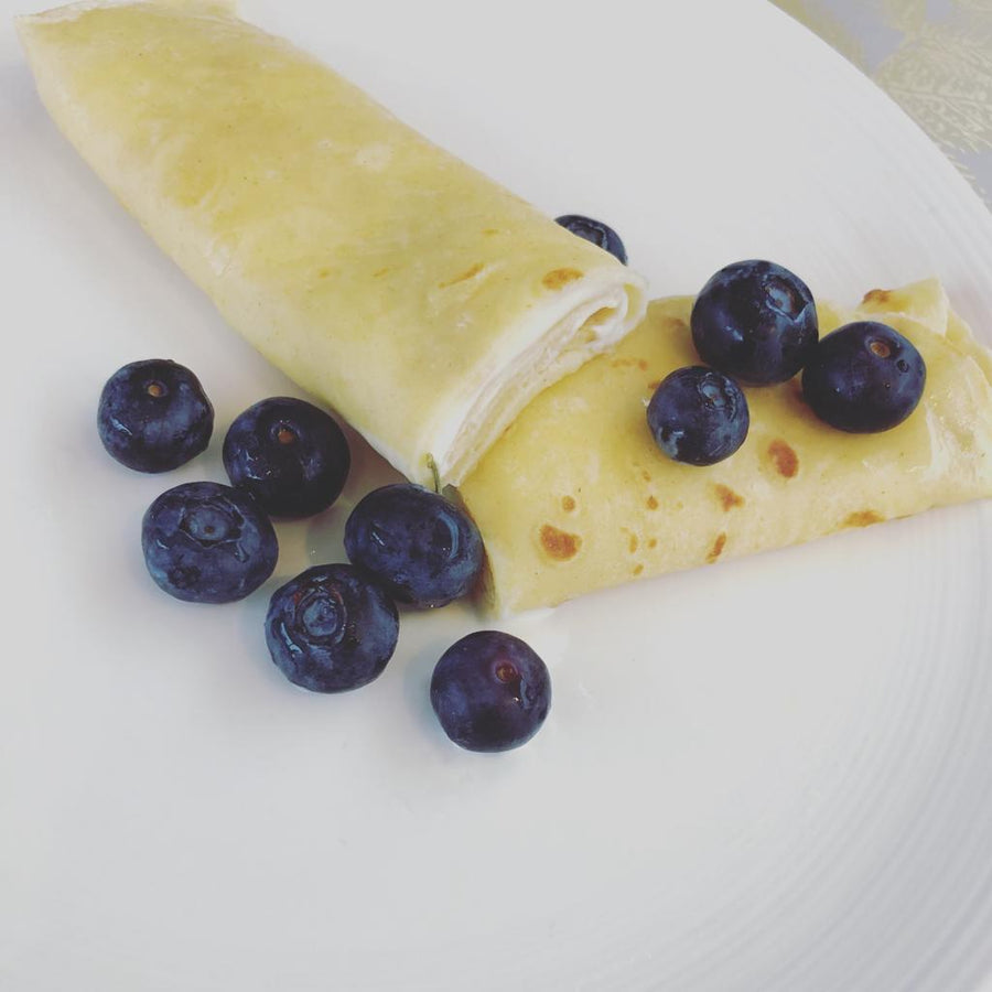 Pancake Day activities for kids with cardboard pancakes and a toy frying pan