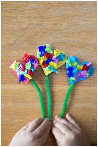 Paper heart flowers with scrunched tissue-paper centres on pipe-cleaner stems