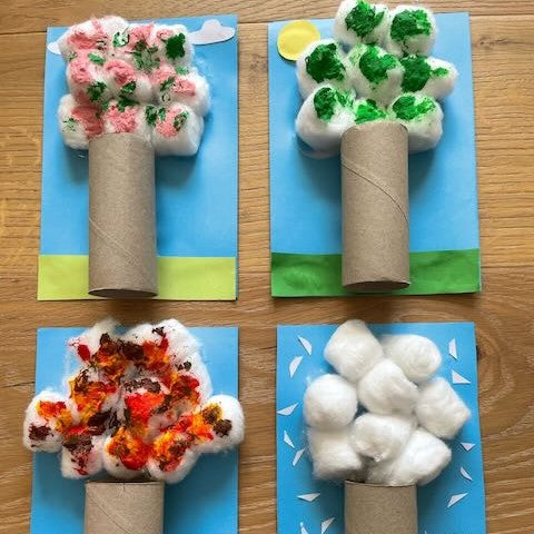 Four seasonal trees made from loo rolls and painted cotton wool