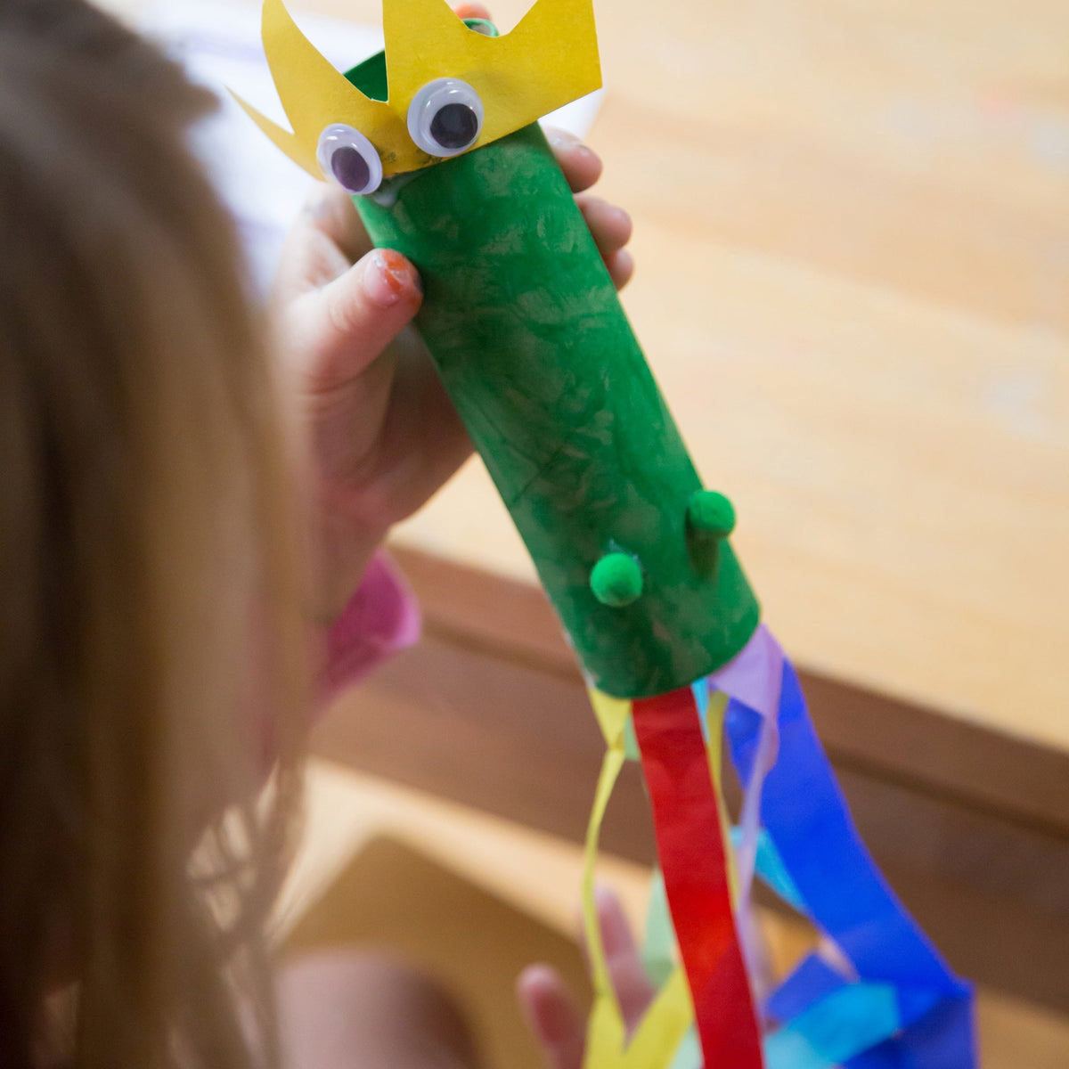 Four toilet roll crafts: a bee, a dragon, a wind kite and a reindeer